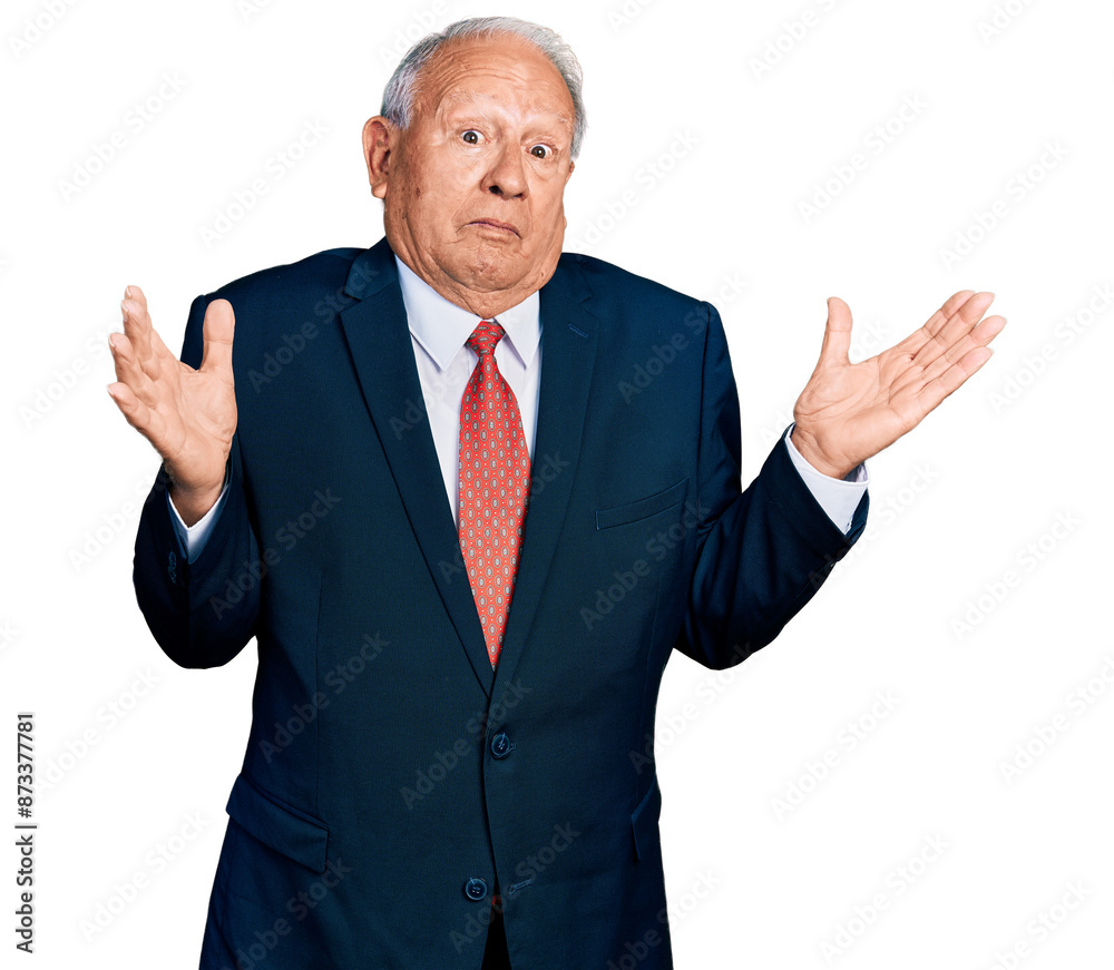 Senior man with grey hair wearing business suit and tie clueless and confused with open arms, no idea and doubtful face. Senior man with grey hair wearing business suit and tie clueless and confused with open arms, no idea and doubtful face.