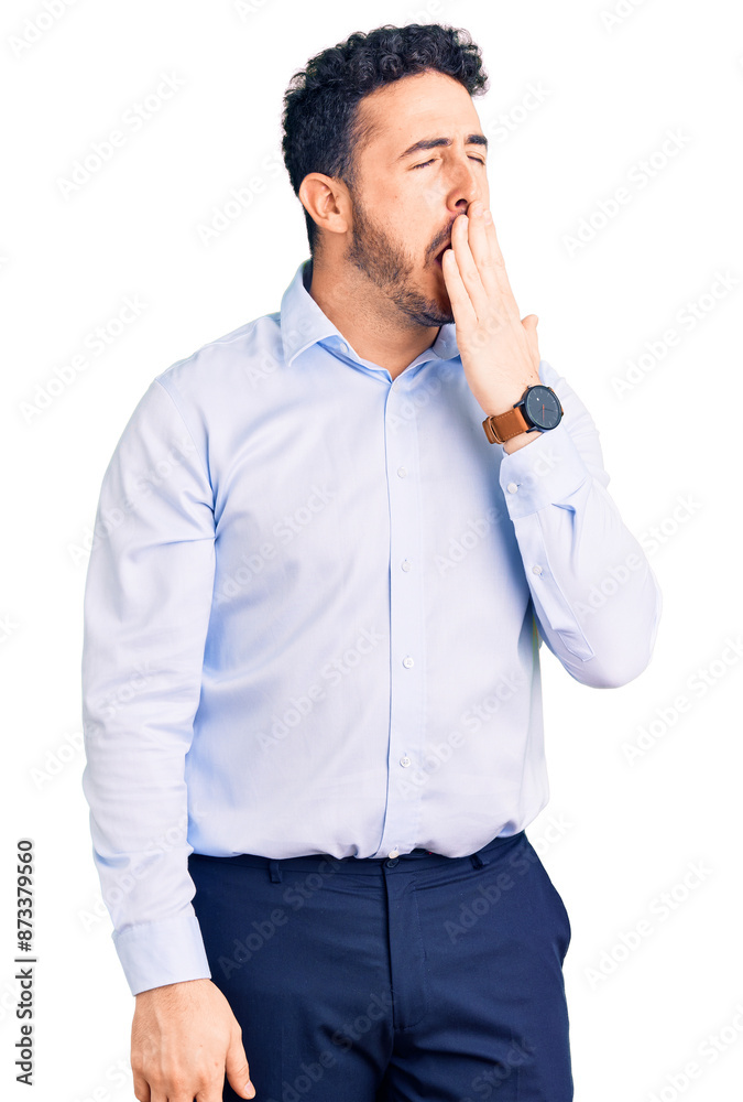 Young hispanic man wearing business clothes bored yawning tired covering mouth with hand. restless and sleepiness. Young hispanic man wearing business clothes bored yawning tired covering mouth with hand. restless and sleepiness.