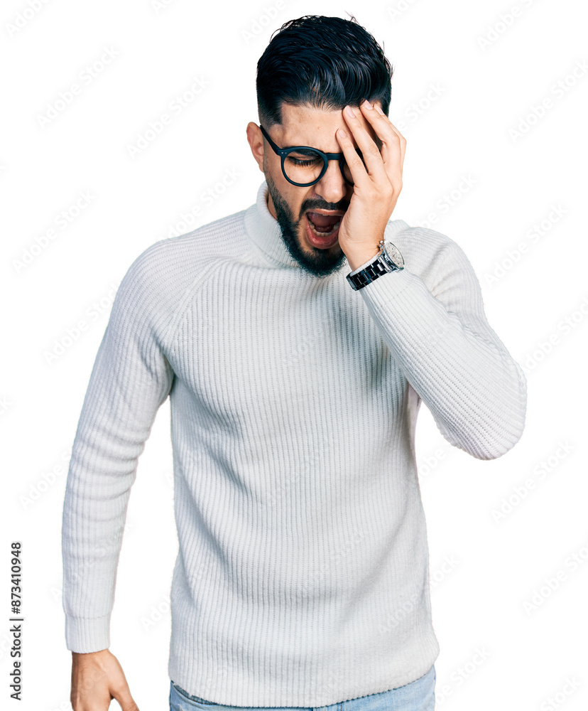 Young arab man with beard wearing elegant turtleneck sweater and glasses yawning tired covering half face, eye and mouth with hand. face hurts in pain. Young arab man with beard wearing elegant turtleneck sweater and glasses yawning tired covering half face, eye and mouth with hand. face hurts in pain.