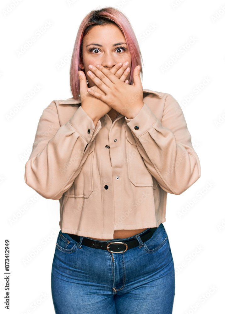 © Krakenimages.com - Hispanic woman with pink hair wearing casual clothes shocked covering mouth with hands for mistake. secret concept.