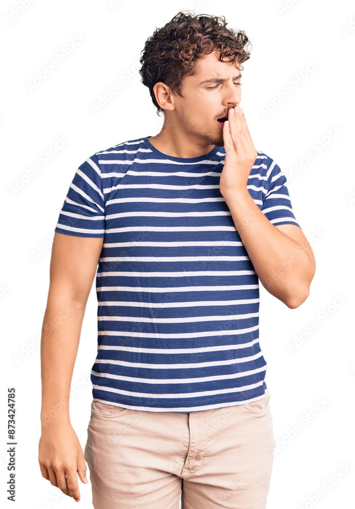 Young handsome man with curly hair wearing casual clothes bored yawning tired covering mouth with hand. restless and sleepiness. Young handsome man with curly hair wearing casual clothes bored yawning tired covering mouth with hand. restless and sleepiness.