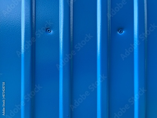 Blue sheet metal pattern with stripes
