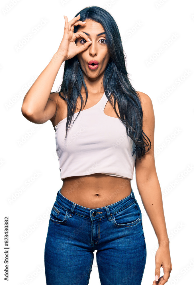 Beautiful hispanic woman wearing casual clothes doing ok gesture shocked with surprised face, eye looking through fingers. unbelieving expression. Beautiful hispanic woman wearing casual clothes doing ok gesture shocked with surprised face, eye looking through fingers. unbelieving expression.