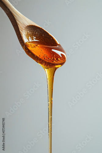 Wallpaper Mural wooden spoon dripping honey on white  Torontodigital.ca
