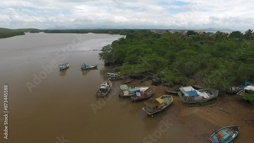 Aerial view of fishing boats in the banks of Itapemirim River - Itapemirim, Espírito Santo, Brazil photo