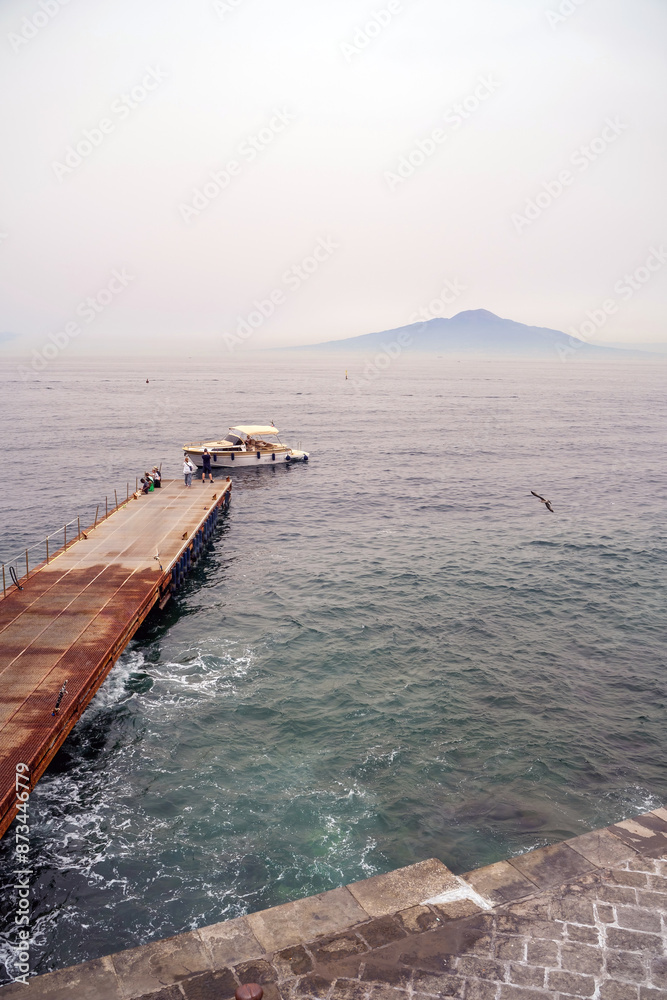 View of Vesuvius volcano and ferries from the observation deck in Sorrento, Italy