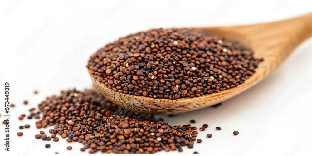 A spoonful of brown seeds is shown on a white background. The spoon is wooden and the seeds are scattered around it. Concept of abundance and variety, as the spoonful of seeds is quite large A spoonful of brown seeds is shown on a white background. The spoon is wooden and the seeds are scattered around it. Concept of abundance and variety, as the spoonful of seeds is quite large