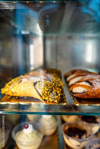 Obraz na płótnie Canolli Sicilian with pistachio cream traditional Italian sweets. Cookies in the form of tubes with a filling in the middle. The concept of Italian food. Vertical orientation. Selective focus w salonie