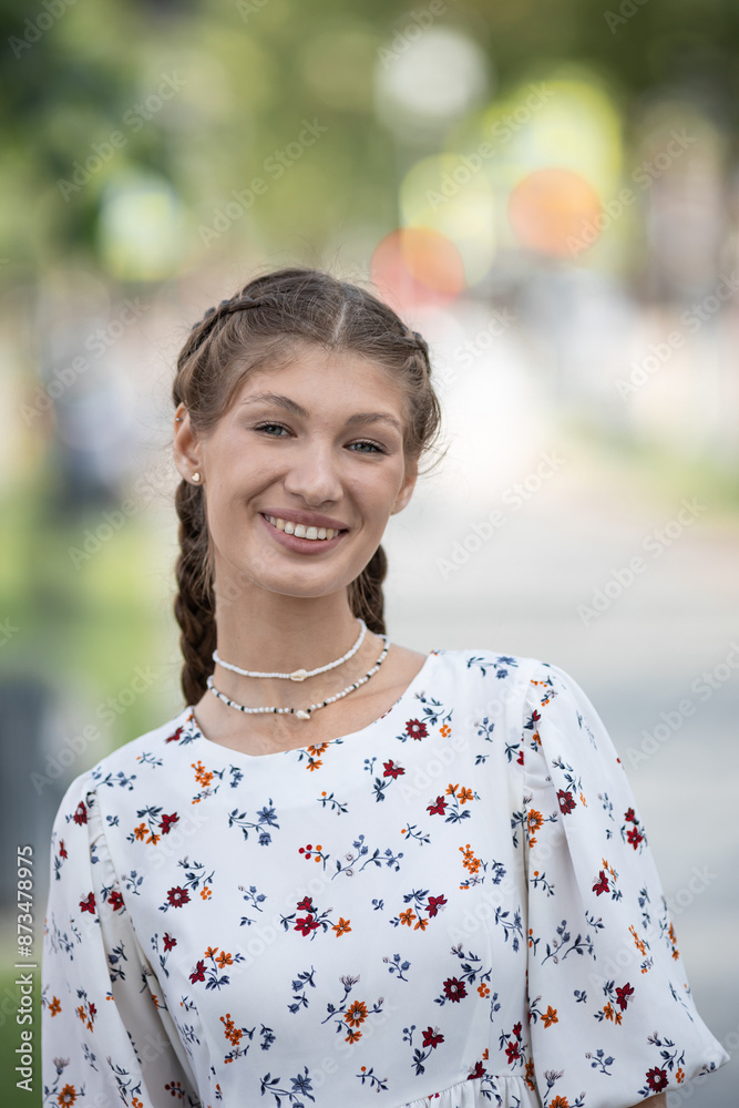 Emotional young woman in dress walking at the sunny street Emotional young woman in dress walking at the sunny street
