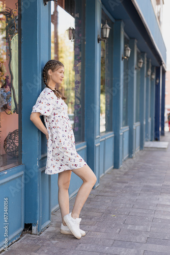 Girl stands leaning against the wall Free Download Girl stands leaning against the wall - GFXLoad