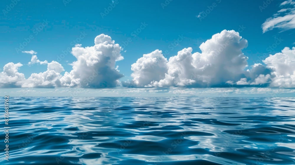 Tranquil sea or ocean scene with calm weather and clouds.
Tranquil sea or ocean scene with calm weather and clouds.