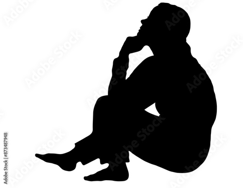 Side profile portrait silhouette of a teenage girl sitting on ground thinking