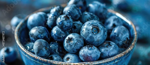 Close-up shot of fresh blueberries in a bowl. Perfect for fresh fruit, healthy eating, and diet themes. AIG62 photo