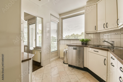 Wallpaper Mural Bright kitchen with modern appliances and balcony access Torontodigital.ca