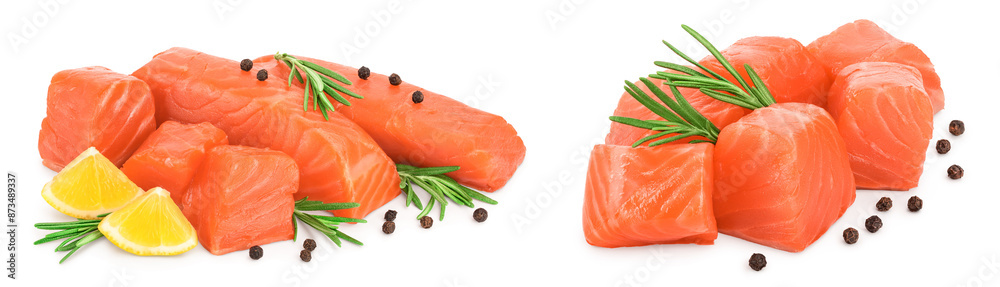 raw salmon piece cube with rosemary, lemon and peppercorn isolated on white background close up raw salmon piece cube with rosemary, lemon and peppercorn isolated on white background close up