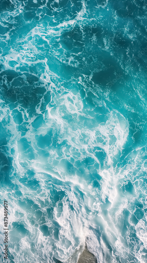 Fototapeta premium Beach and waves from top view. Turquoise water background from top view