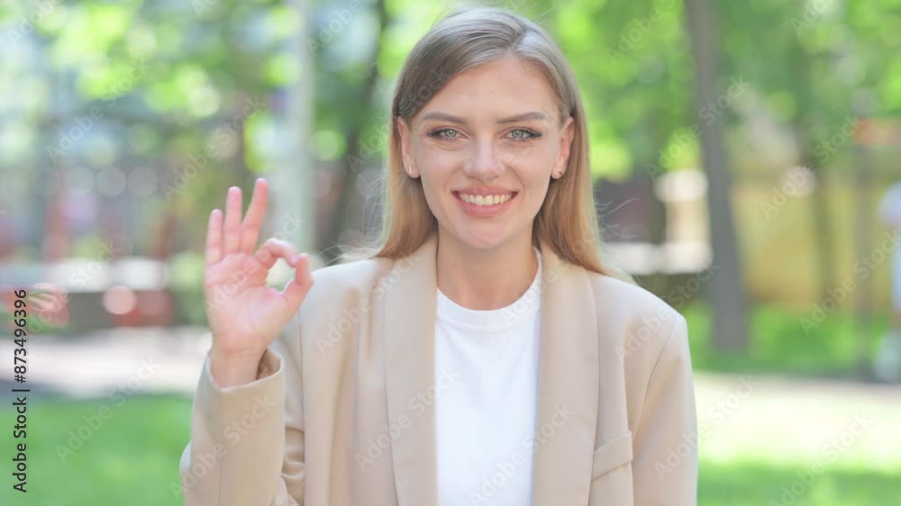 Portrait of Businesswoman with Okay Sign Outdoor Portrait of Businesswoman with Okay Sign Outdoor