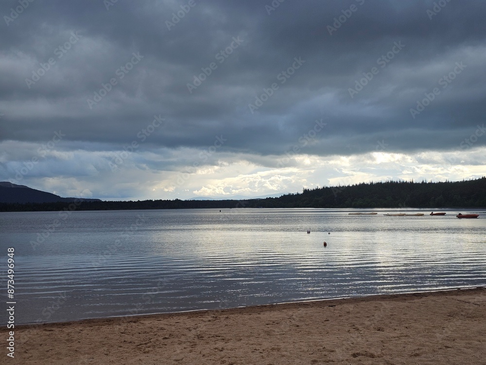 Obraz premium Loch Morlich, Glenmore, Scotland's only fresh water award winning beach is situated at the foot of the Cairngorms, right at the heart of the National Park