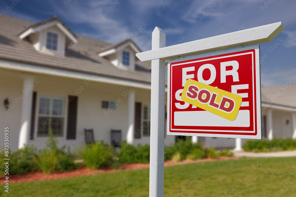 Sold For Sale Real Estate Sign in Front of Beautiful House. Sold For Sale Real Estate Sign in Front of Beautiful House.