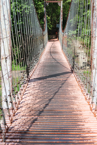 The old iron bridge is hanging. photo