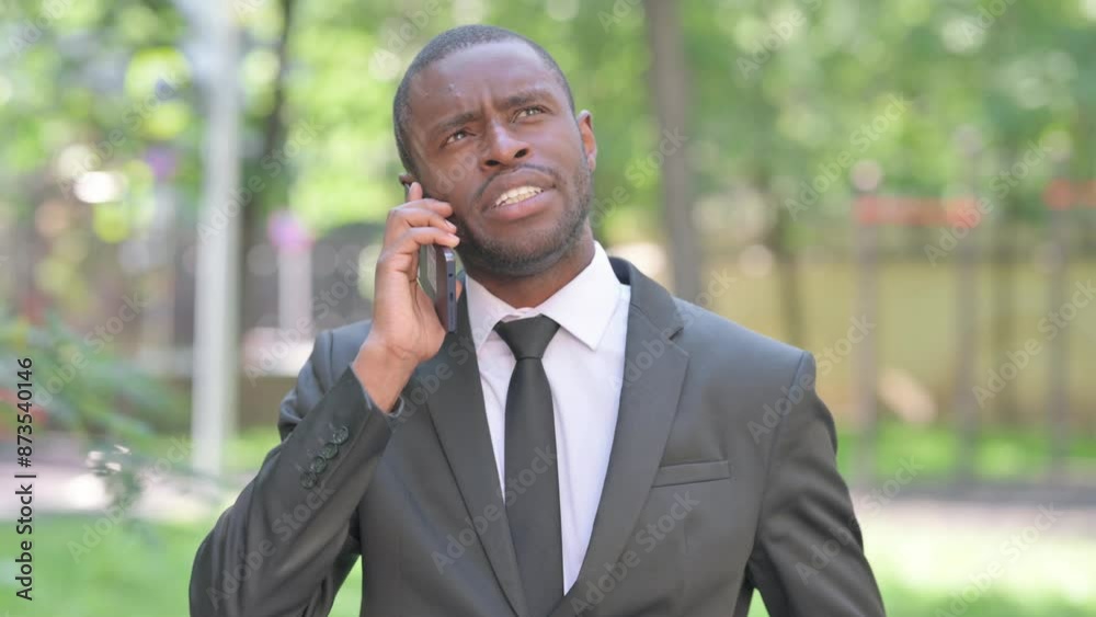 Portrait of African Man Talking on Phone Outdoor Portrait of African Man Talking on Phone Outdoor
