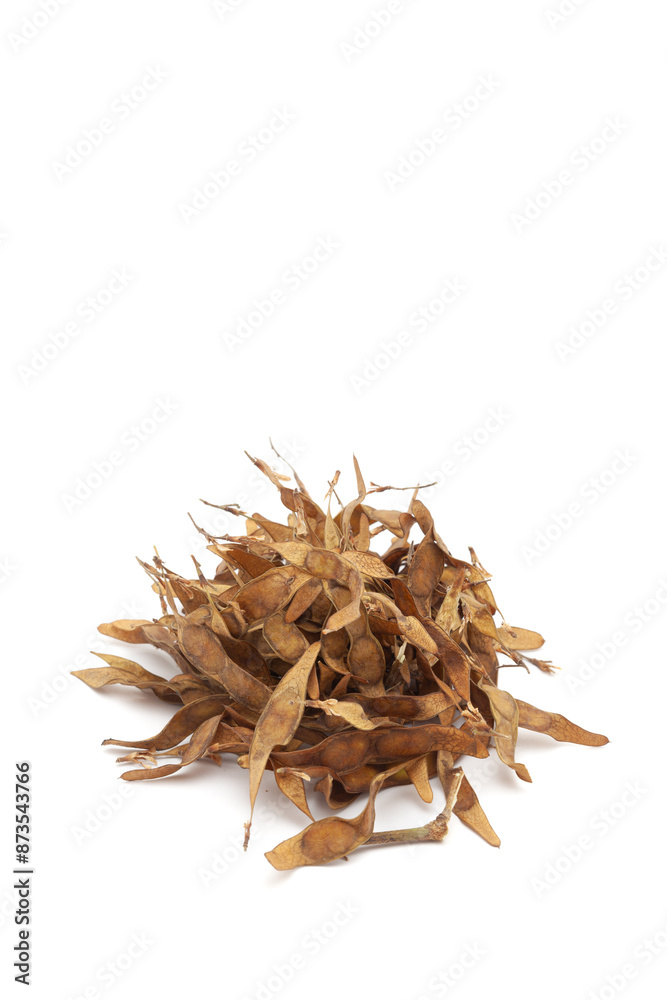 A pile of dry organic Indian Rosewood (Dalbergia sissoo) or Sheesham leaves. Isolated on a white background. A pile of dry organic Indian Rosewood (Dalbergia sissoo) or Sheesham leaves. Isolated on a white background.