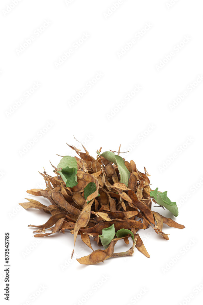 A pile of dry organic Indian Rosewood (Dalbergia sissoo) or Sheesham leaves. Isolated on a white background. A pile of dry organic Indian Rosewood (Dalbergia sissoo) or Sheesham leaves. Isolated on a white background.