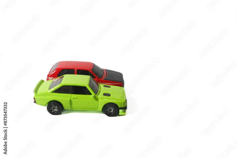 green and red toy cars on isolated white background green and red toy cars on isolated white background