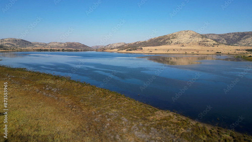 Fototapeta premium African Lake At Rustenburg In North West South Africa. African Animals Landscape. Pilanesberg National Park. Rustenburg At North West South Africa. Big Five Animals. Wildlife Safari.