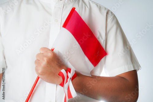 hands waving the flag excited to celebrate Indonesia's independence day on August 17 photo