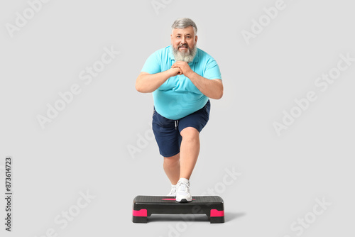 Overweight happy mature man...