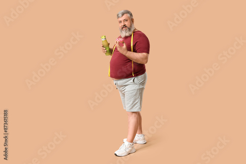 Overweight mature man with ...