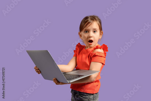 Shocked little girl with la...