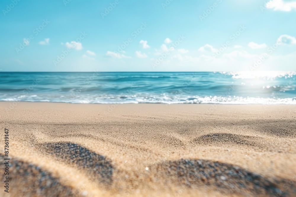 Serene Sandy Beach with Gentle Waves and Clear Blue Sky on a Sunny Day Serene Sandy Beach with Gentle Waves and Clear Blue Sky on a Sunny Day