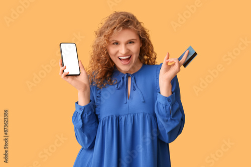 Happy young woman with cred...