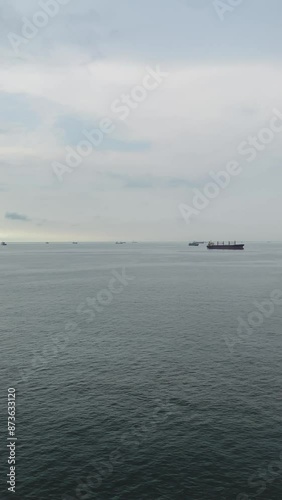 Distant View Of The Ship Carrying The Oil Tanker In The Sea Port