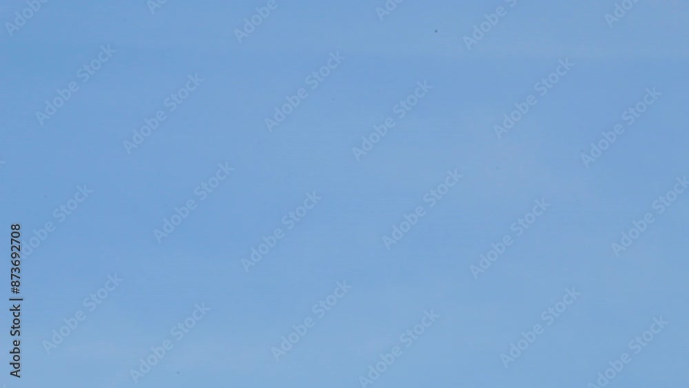 A kite blown by a strong wind with sky in the background on a sunny morning A kite blown by a strong wind with sky in the background on a sunny morning