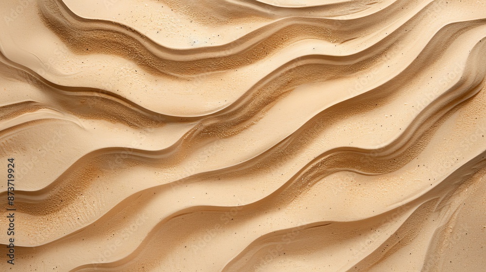 A top view of a textured background featuring sand with smooth lines, possibly created by the wind or water, illustrating a natural and serene beach or desert landscape. A top view of a textured background featuring sand with smooth lines, possibly created by the wind or water, illustrating a natural and serene beach or desert landscape.