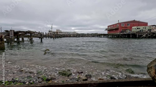 Docked boat at a wooden pier photo