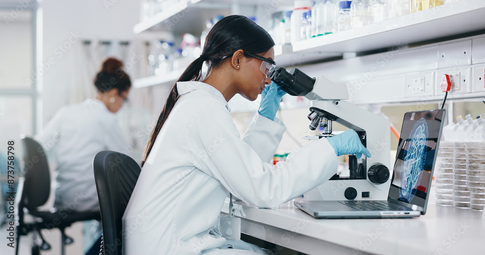 Obraz premium Laptop, research and woman with microscope, science and check experiment for cancer treatment. Person, scientist and employee with lab equipment, vaccine and cure development with dna and bacteria
