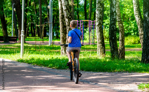 Wallpaper Mural Cyclist ride on the bike path in the city Park
 Torontodigital.ca