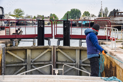 Obraz na płótnie woman locking through a lock chamber on a canal in France w salonie