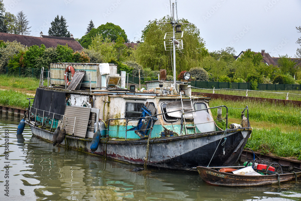 abandoned boat on a river in France