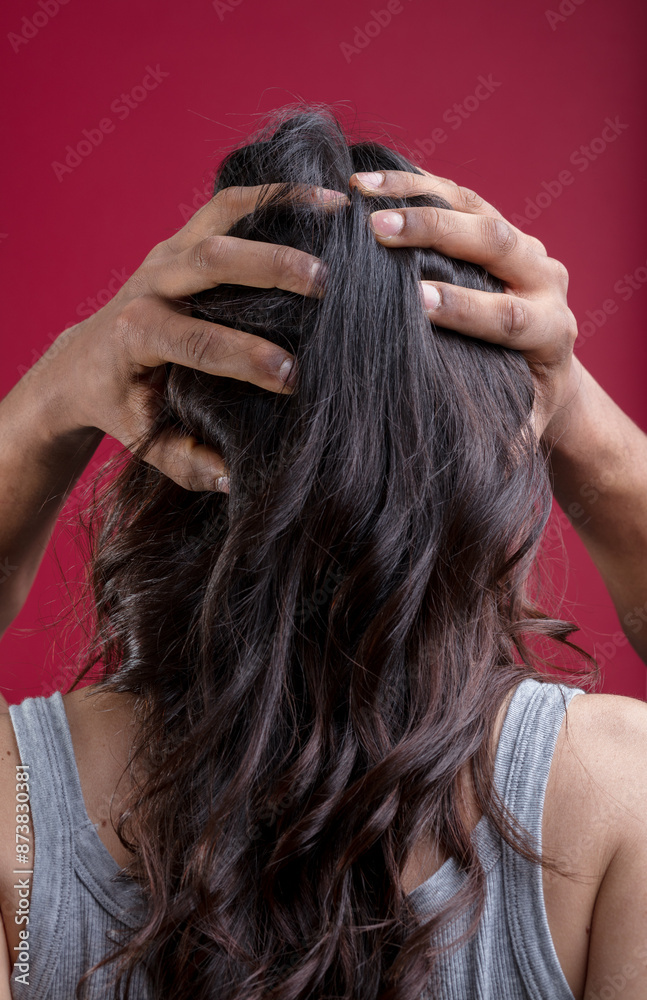 Fototapeta premium Woman's head held, symbolizing gender fluidity, inclusivity