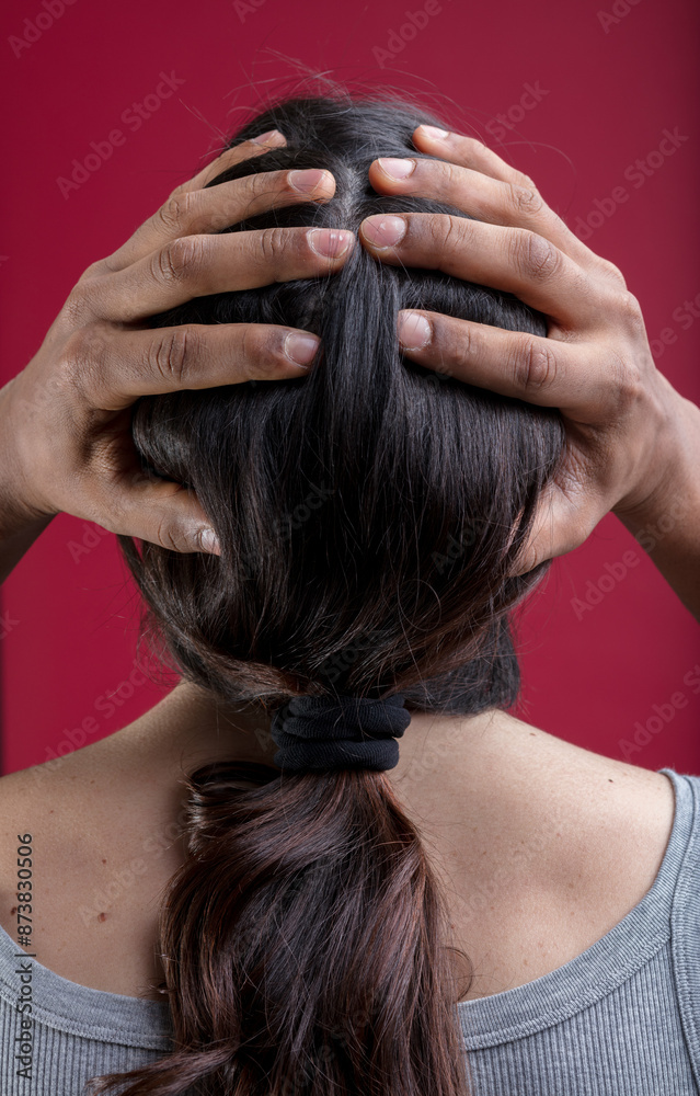 Naklejka premium Hands hold head, representing inclusivity and fluidity
