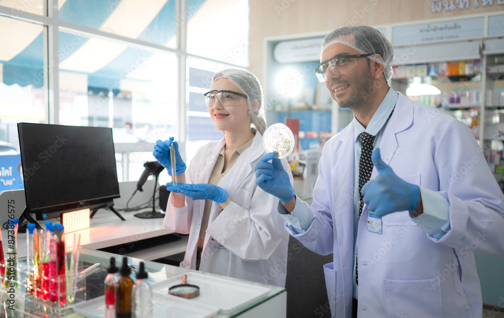 Pharmacist and chemical scientist doing antibiotic trials and testing in the laboratory Pharmacist and chemical scientist doing antibiotic trials and testing in the laboratory