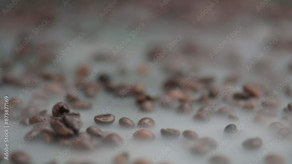 Close-up push in through the steaming coffee beans Close-up push in through the steaming coffee beans