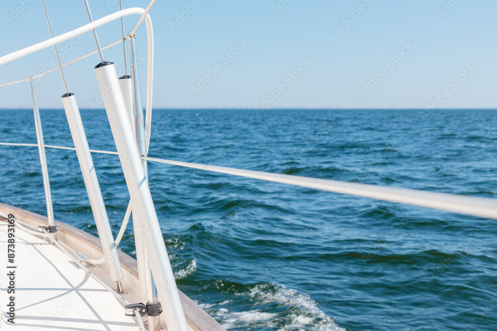 Obraz premium Turnbuckle aluminum covers on a classic sailboat on the side deck. Summer adventure, open sea with waves, recreation, cruise, vacations, regatta, sport in Finland, Gulf of Finland