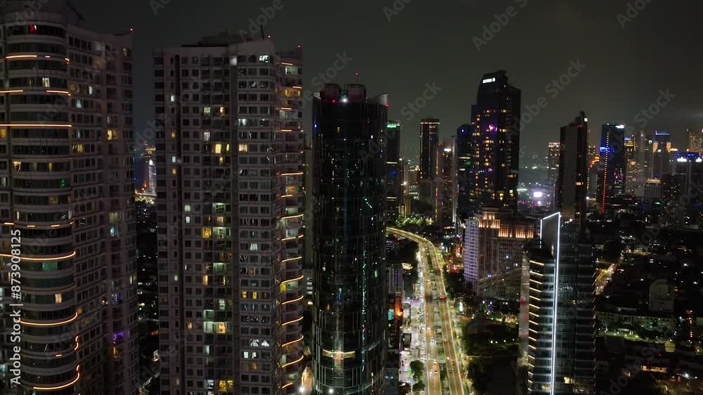 Night downtown Jakarta with high-rise buildings. Night downtown Jakarta with high-rise buildings.