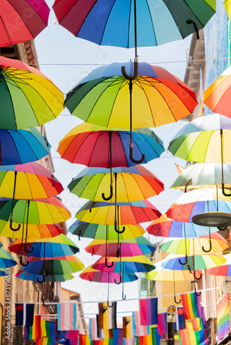Colorful umbrellas decorated with the gay pride flag on the streets of Madrid, Spain. LGTB
